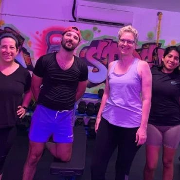 People posing at Speakeasy of Strength Brooklyn